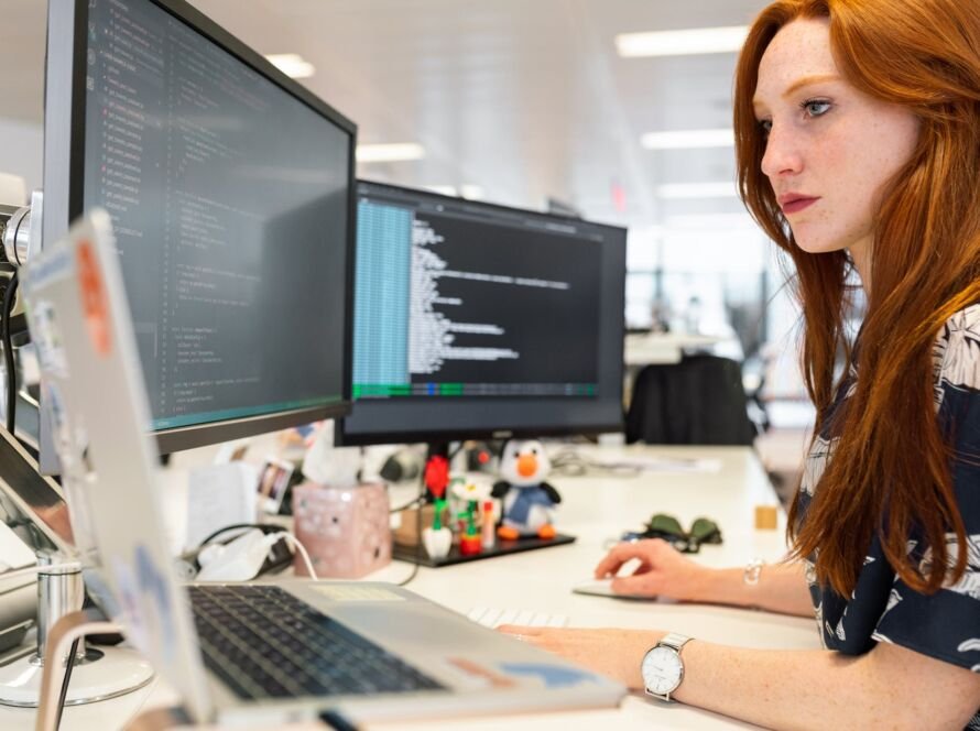 woman coding on computer